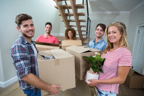 Packed boxes and furniture ready for a removal truck move