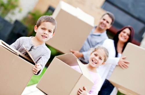 Moving team preparing a van near homes in Norbiton