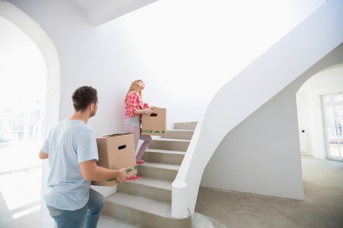Local furniture removal van loading items from a Norbiton property