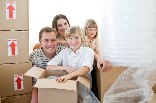 Packed boxes and furniture ready for a home removal in Norbiton