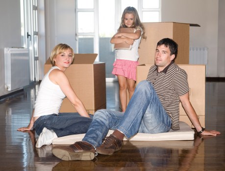 Packed boxes and furniture ready for transport during a Norbiton house move